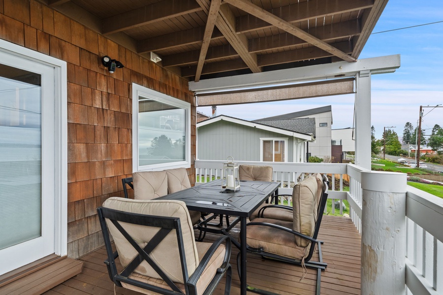 Your private deck awaits with comfy seating for morning coffee or evening meals while soaking in neighborhood views.