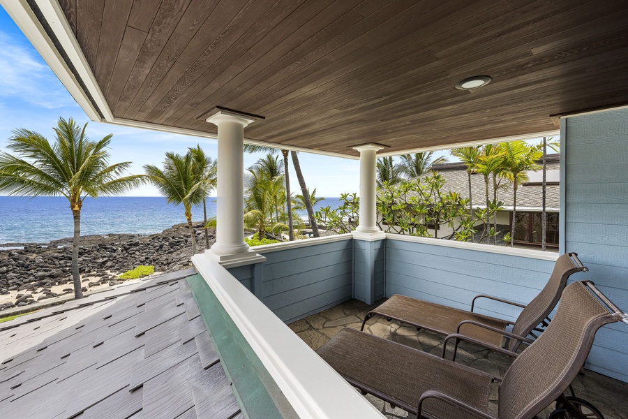 Lounge chairs on the primary lanai offer a peaceful retreat with ocean breezes.