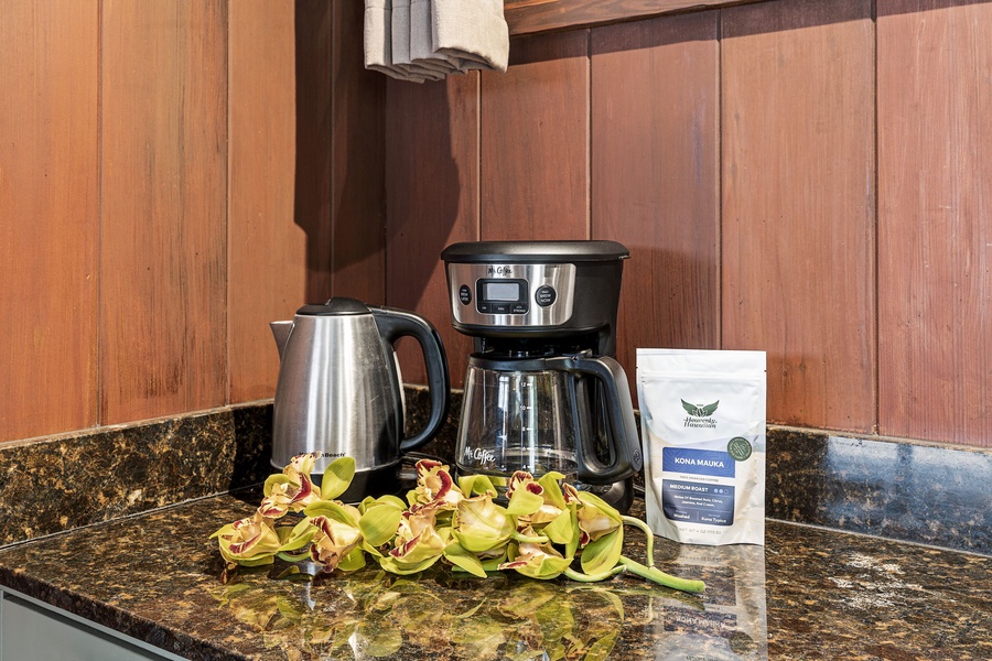 Wake up to the aroma of fresh Hawaiian coffee—your mornings here start with a complimentary kettle, coffee maker, and premium Kona Mauka beans waiting on the counter.