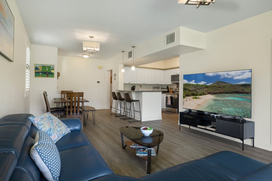 Unwind in this bright open-concept space where you can cook in the modern kitchen while chatting with loved ones on the leather sofa.