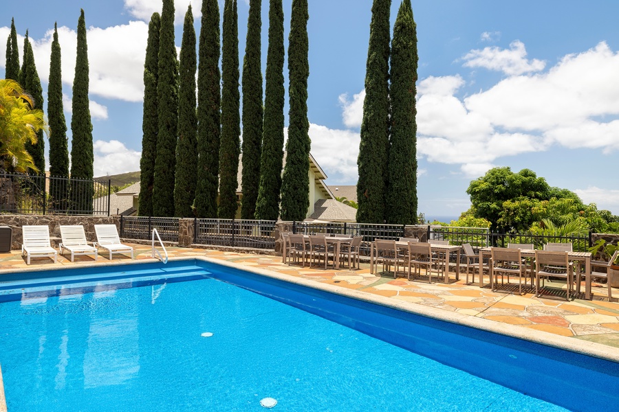Framed by lush trees and the hills of Makakilo, the pool offers privacy, peace, and a refreshing escape from warm island days.