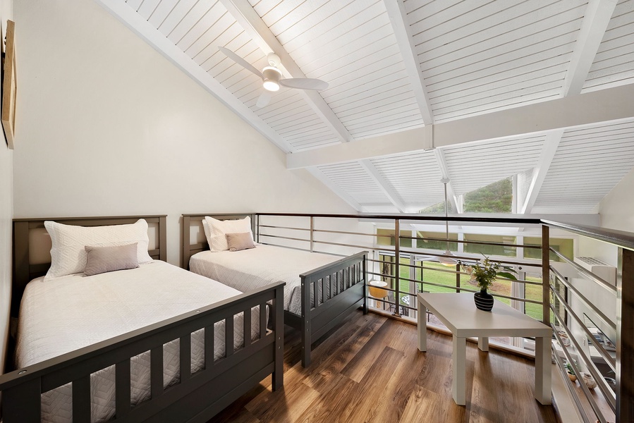 Two twin sized beds in the loft.