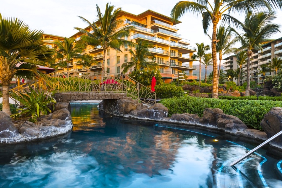 Enjoy peaceful moments by the tranquil waters of Honua Kai Resort, surrounded by lush greenery.