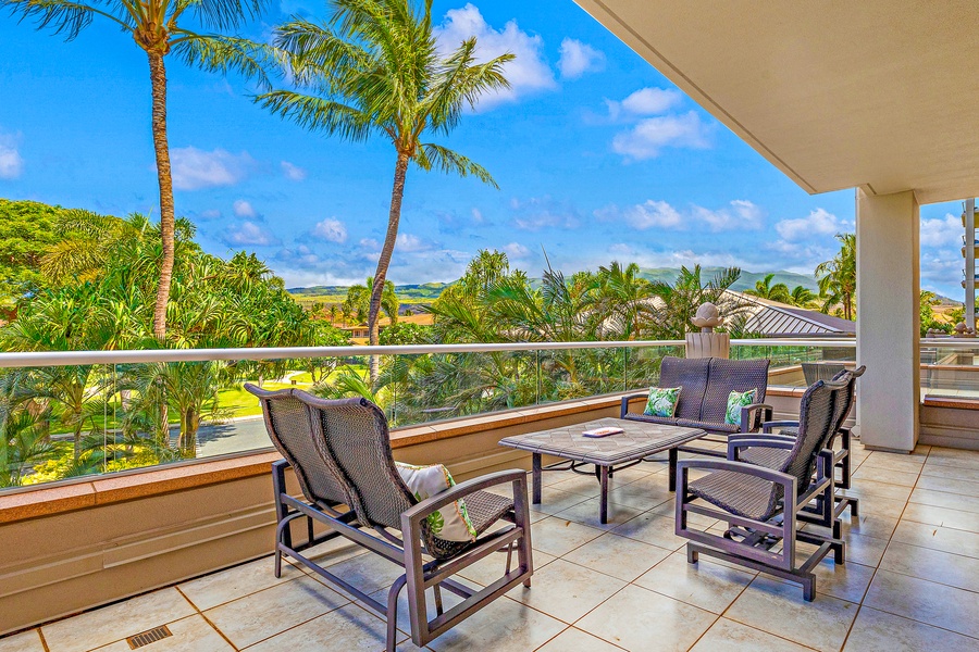 Relax on the spacious lanai featuring comfortable seating and picturesque views of Hawaii.