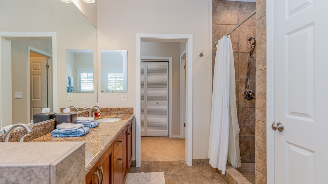 The primary guest bath has a soaking tub and walk-in shower.