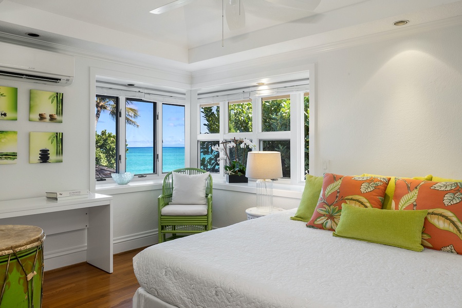 The fourth guest bedroom is also upstairs and has a king bed and ocean views
