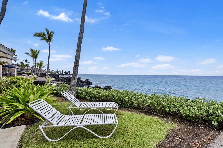 Lounge by the shoreline just steps from your lanai for ultimate oceanfront relaxation.