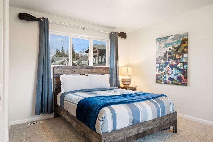 Sink into your comfortable bed with crisp linens and wake up to natural light streaming through the large windows.