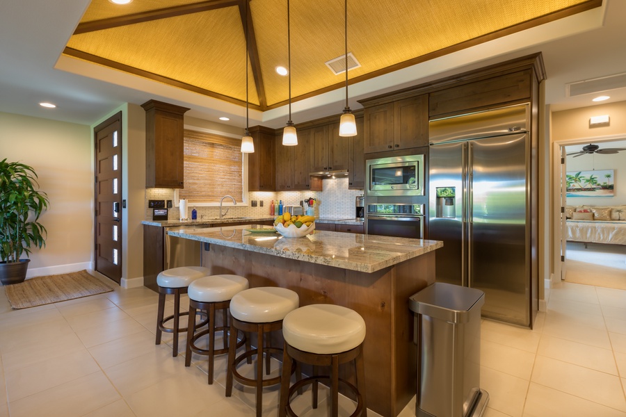 Gorgeous open kitchen with bar seating.