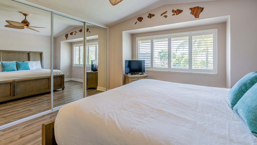 Wake up refreshed to views of island skies in the primary guest bedroom.