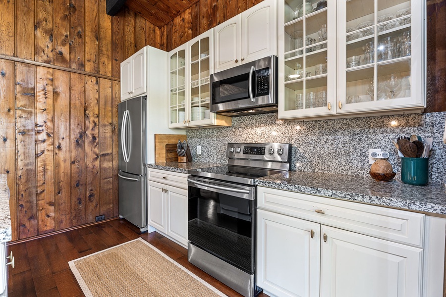 Your fully equipped kitchen blends rustic charm with modern convenience, featuring granite counters and stainless appliances for memorable meal prep.