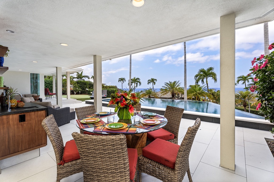 Ocean-view outdoor dining under a covered lanai, perfect for breezy breakfasts or sunset dinners with your favorite people.