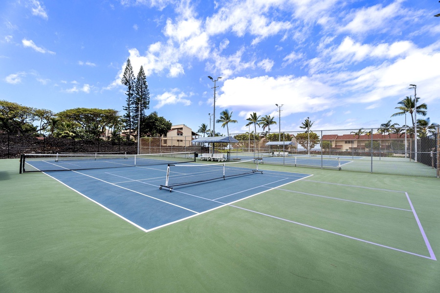 Enjoy a match with beautiful tropical views on this spacious tennis court.