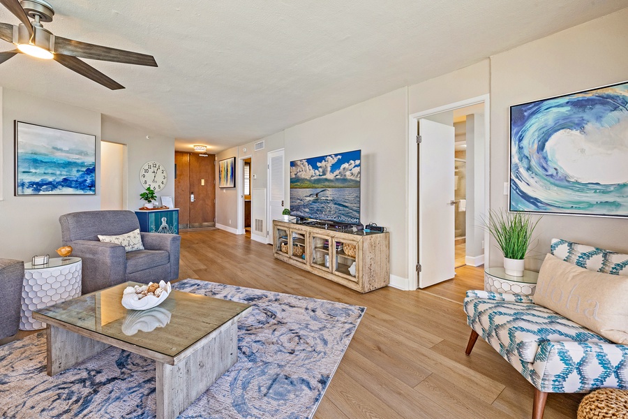 Royal Kahana 1010 features a cozy living area with a large TV and plenty of seating.