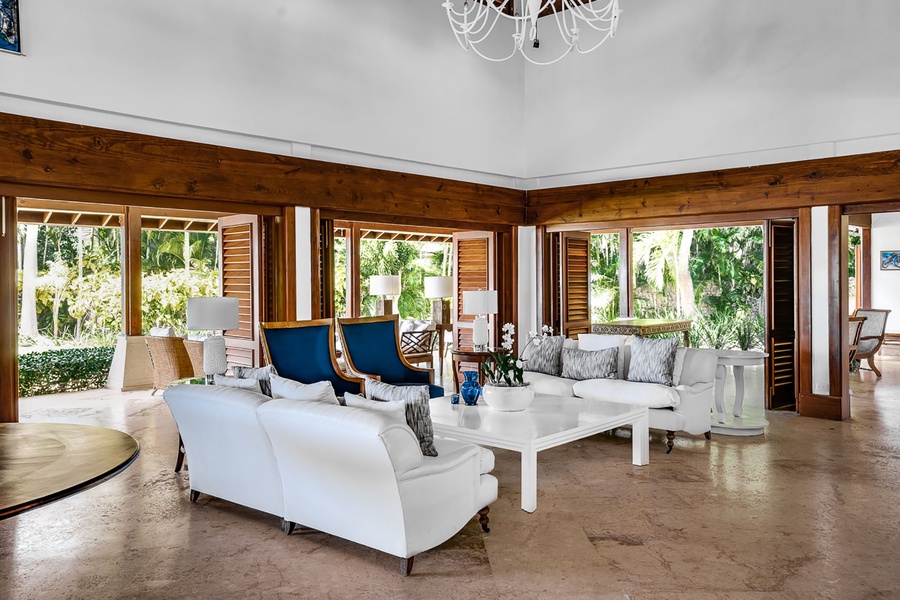 The living area has luxury furnishing featuring that opens to the patio for a seamless indoor-outdoor living.