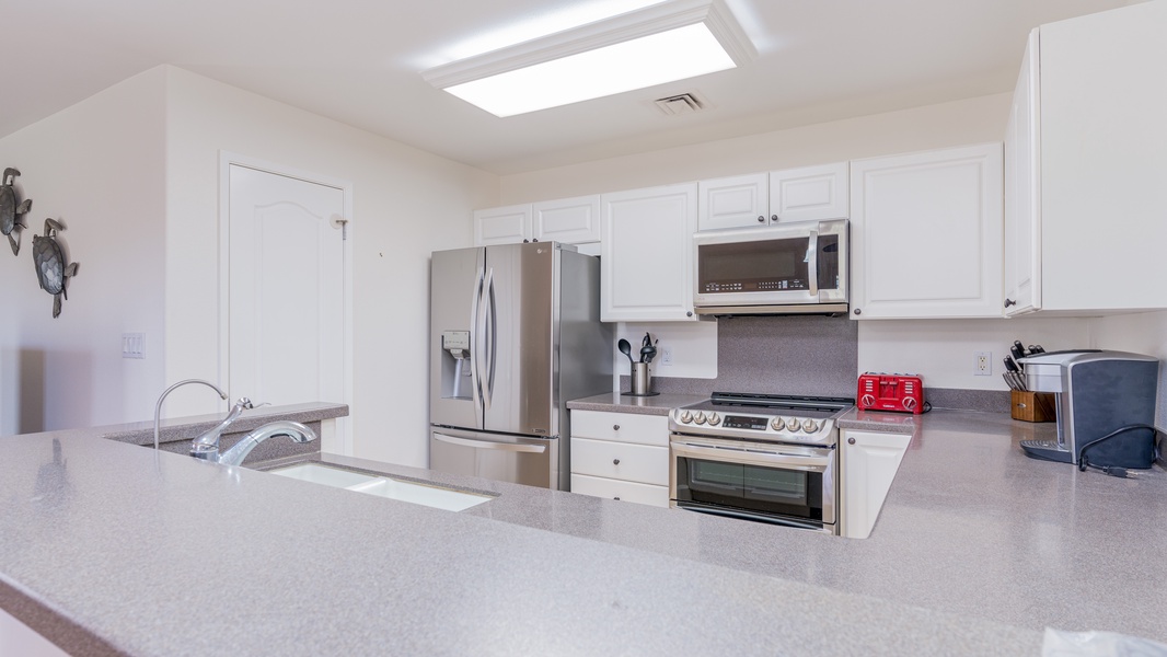 The kitchen's large counter top is ideal for hosting.