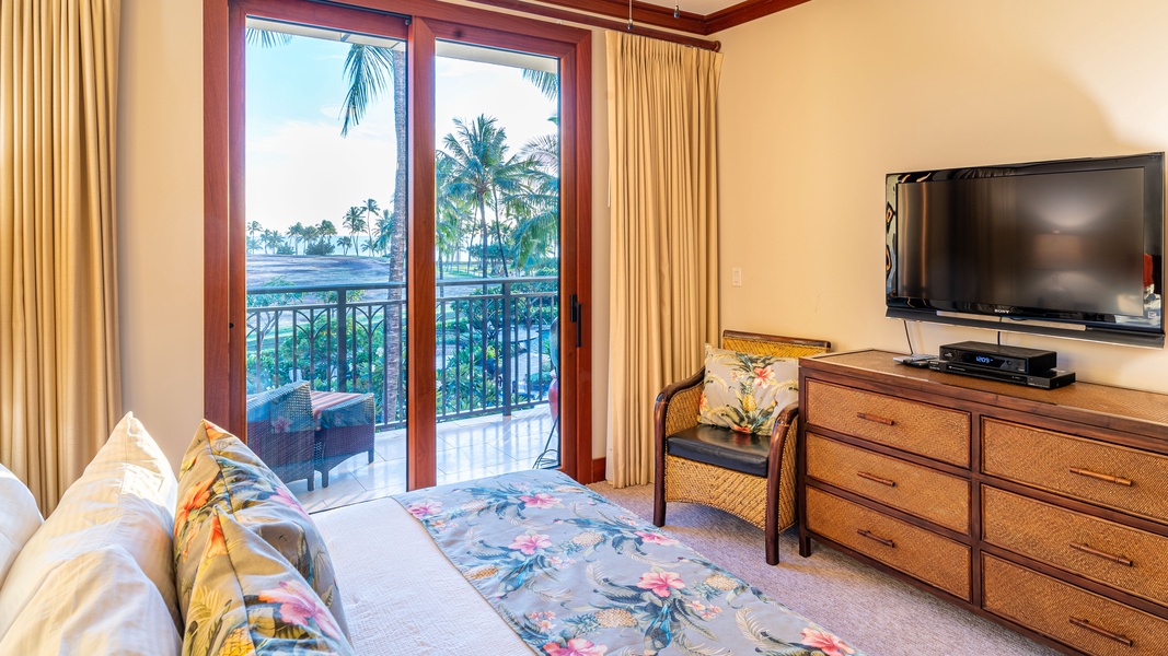 The primary guest bedroom with access to the lanai and storage.