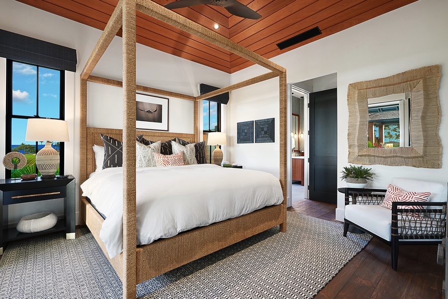 The guest bedroom features king bed with lofted ceilings and a restful night.