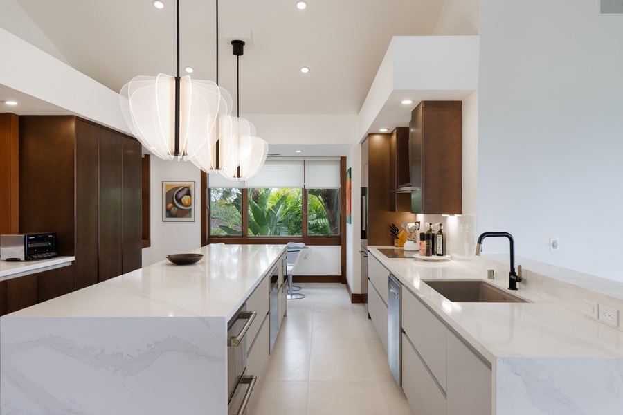 Elevate your cooking experience with top-of-the-line appliances in this gourmet kitchen.