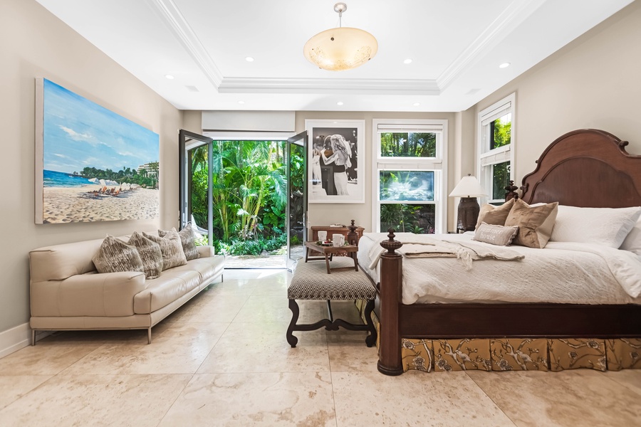 Light-filled suite with pool views and elegant decor.