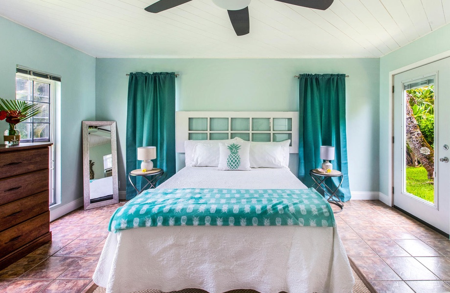 Bright and vibrant bedroom with elegant turquoise accents and natural light.