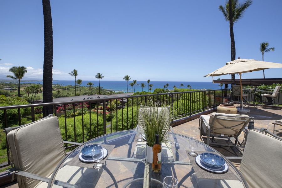 Intimate lanai setup with a bistro table and panoramic views—ideal for morning coffee or sunset wine.