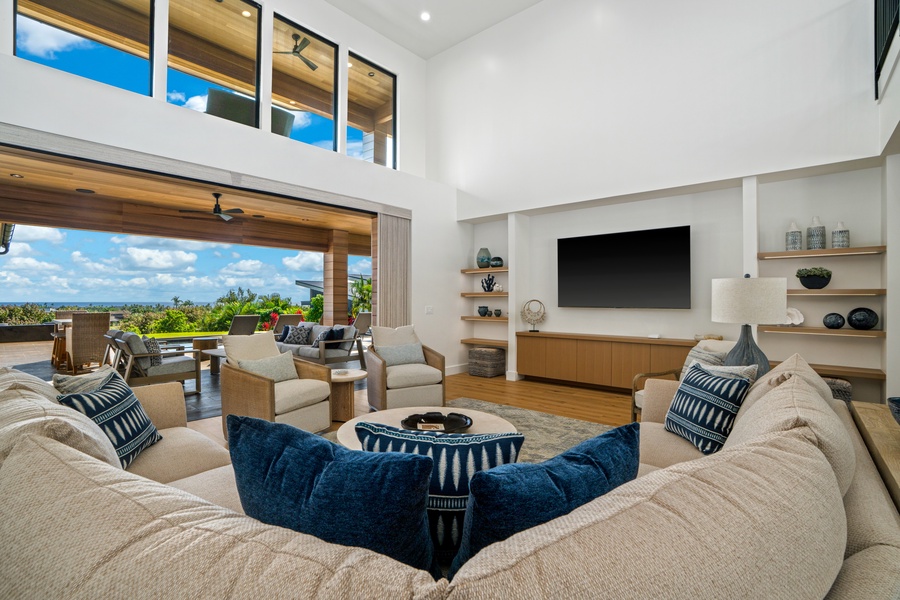 Sink into plush seating with stunning views through floor-to-ceiling windows. Your perfect retreat blends modern comfort with tropical paradise.