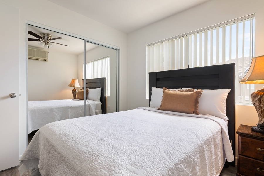 Sink into your comfortable bed with soft linens and warm lighting creating the perfect retreat for restful nights.