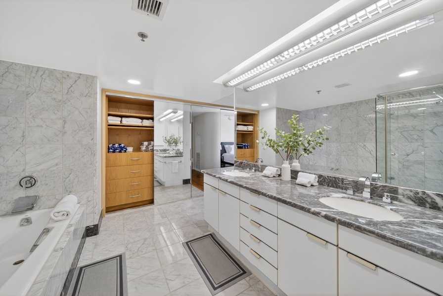 Indulge in this spacious ensuite featuring spa-like finishes and generous counter space.