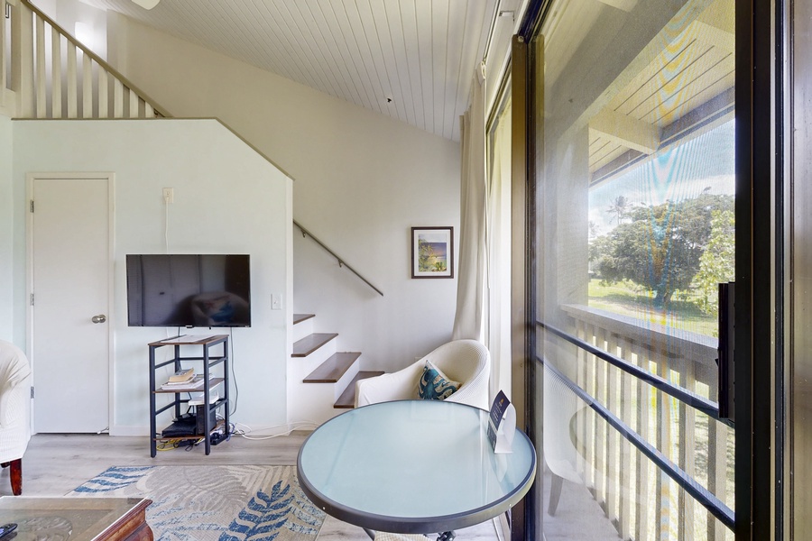 Staircase leading to open loft bedroom above.