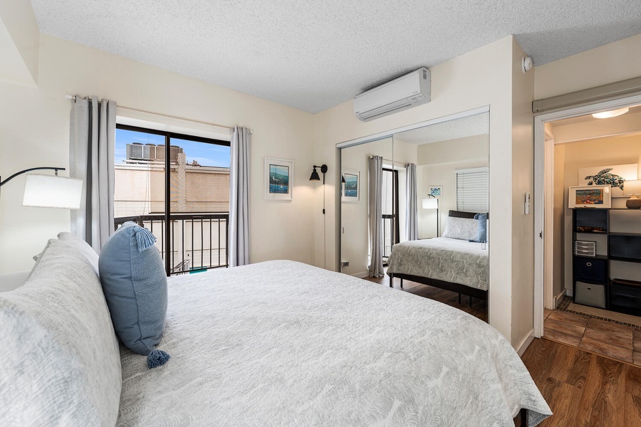 Unwind in your peaceful bedroom with soft linens, city views, and climate-controlled comfort for the perfect night's rest.