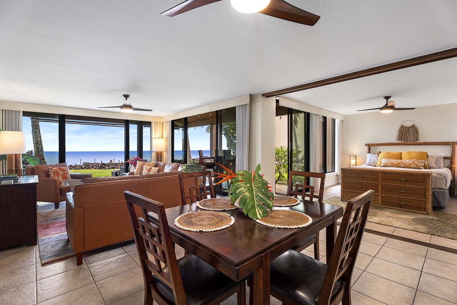 The dining area is right beside the living space, in between the living and kitchen areas.