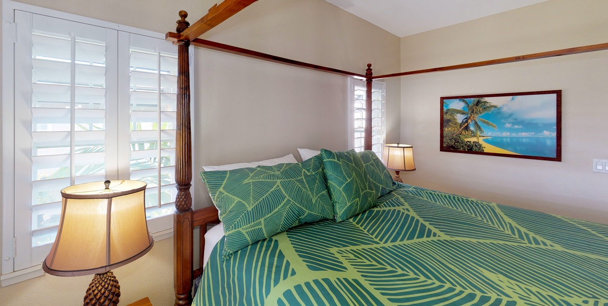 The primary guest bedroom with comfortable surroundings and natural lighting.