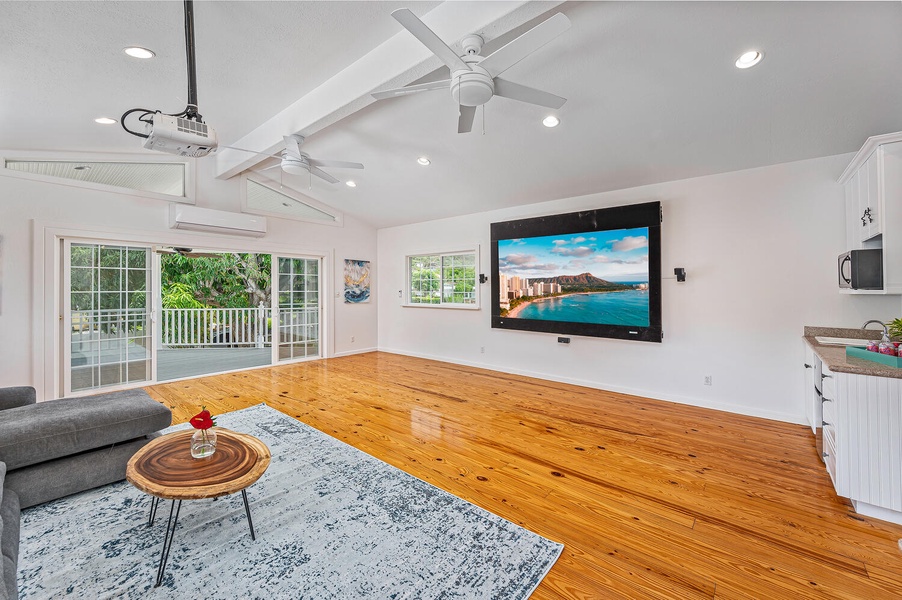 Media room with a large deck that has a birds eye view of the pool!