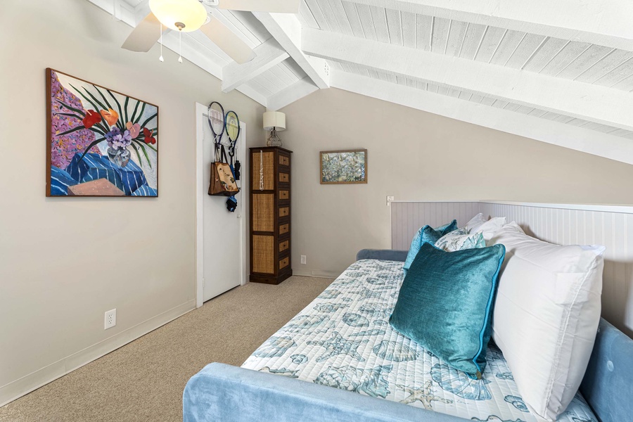 Island decor adorns the classic loft bedroom