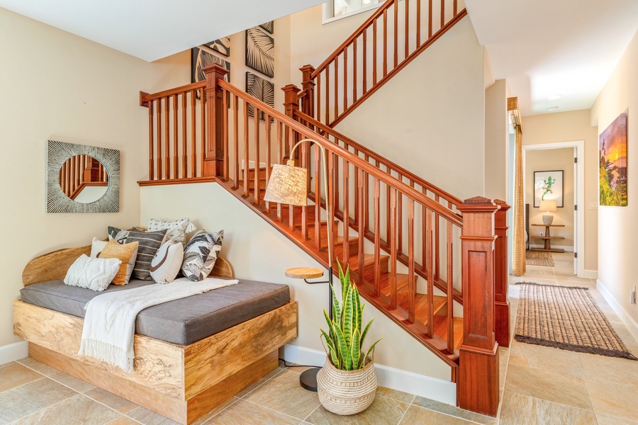Elegant staircase connects the ground level with the upper level.