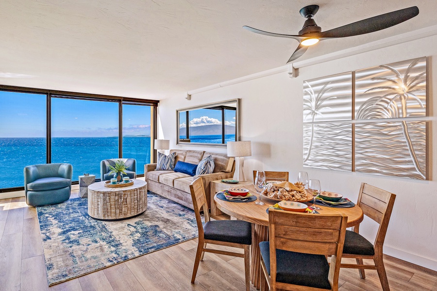 The living and dining area at Mahana 1118 offers breathtaking views and coastal comfort.