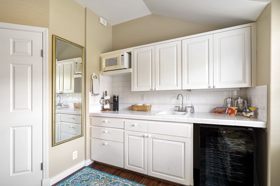 Well-equipped kitchenette includes a coffee bar, microwave, and mini fridge.