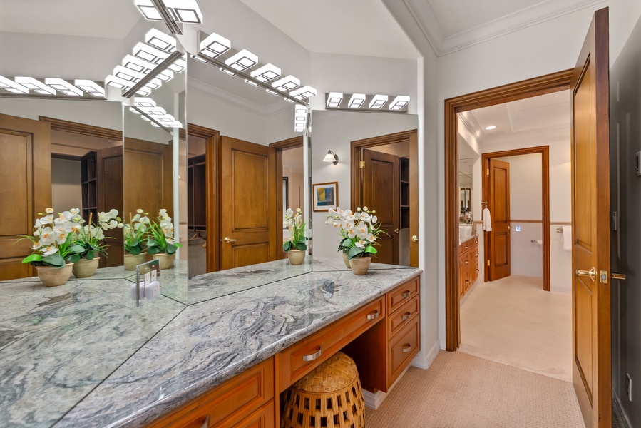 Bright skylights, marble finishes, and warm wood details create a polished space to refresh and unwind.