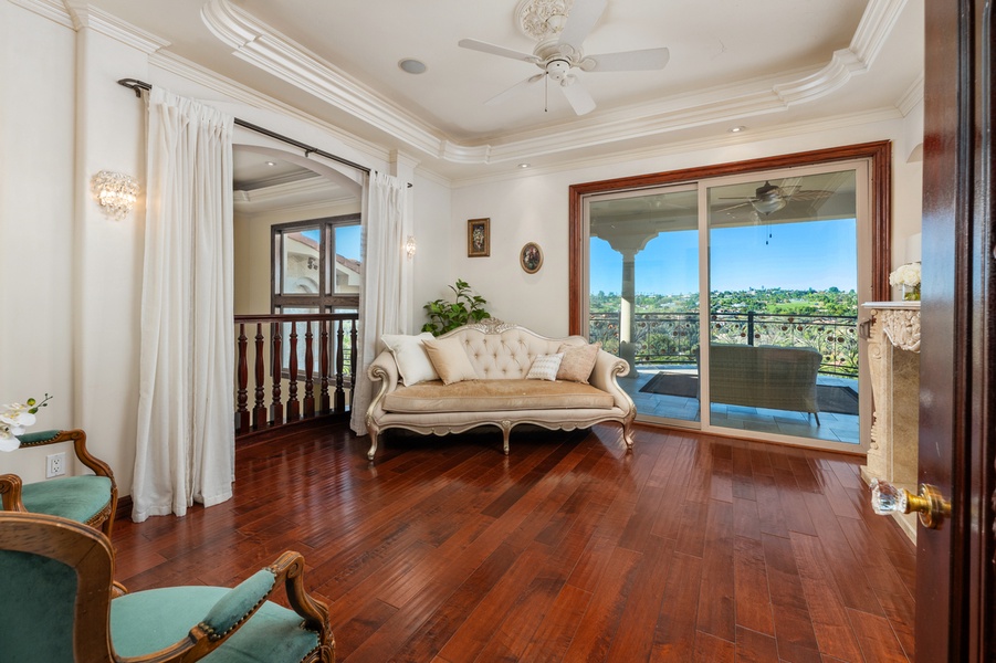 A seating beside sliding doors that open straight onto the balcony.