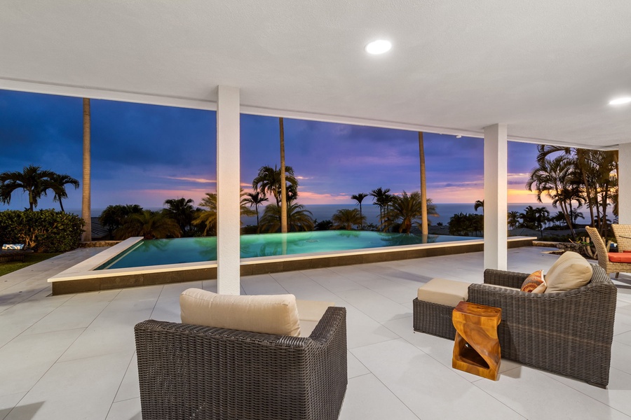 Soak in golden hour views from the lanai overlooking the serene pool.