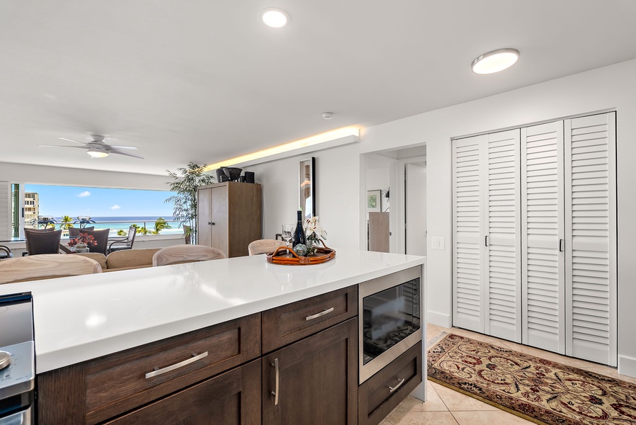 Ocean glimpses from the sink and prep counter, turning meal prep into a scenic ritual.