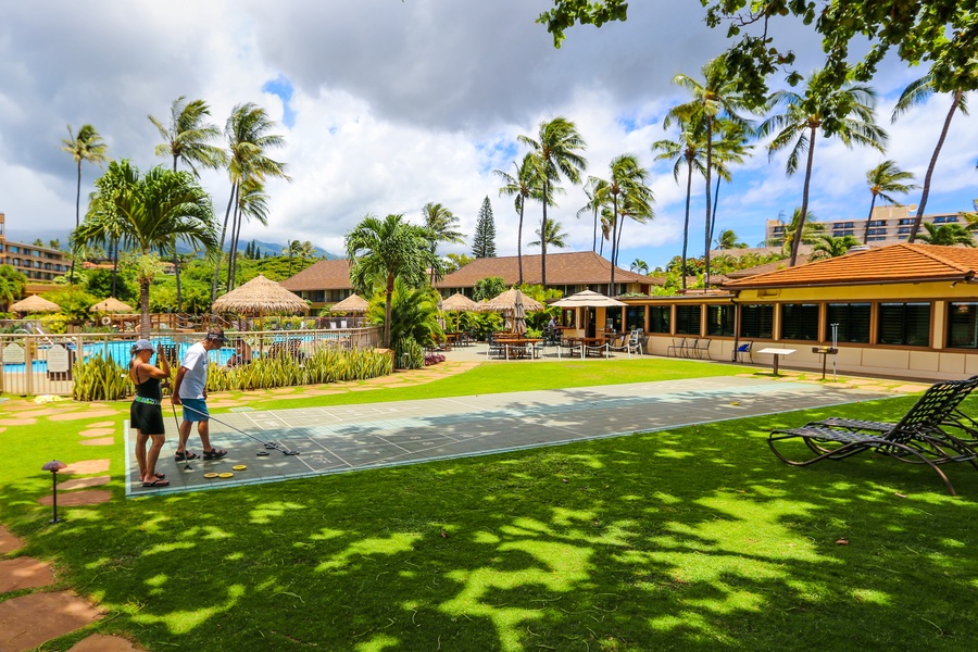 Enjoy a sunny day of fun and leisure with activities like shuffleboard in this beautiful resort setting