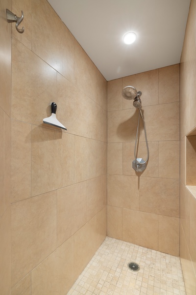 Walk-in shower in the primary bathroom.