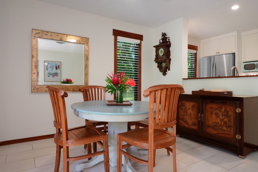 Intimate gatherings await: a cozy dining room with a four-seat dining table perfect for shared meals