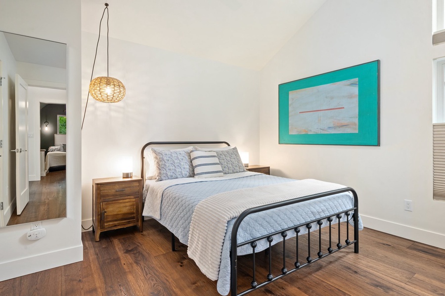 The Baker Suite has a queen bed, cheerful colors, and a cozy vibe.