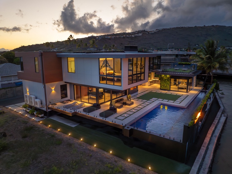 Golden hour highlights the villa’s elevated position and open-air design—luxury from every angle.