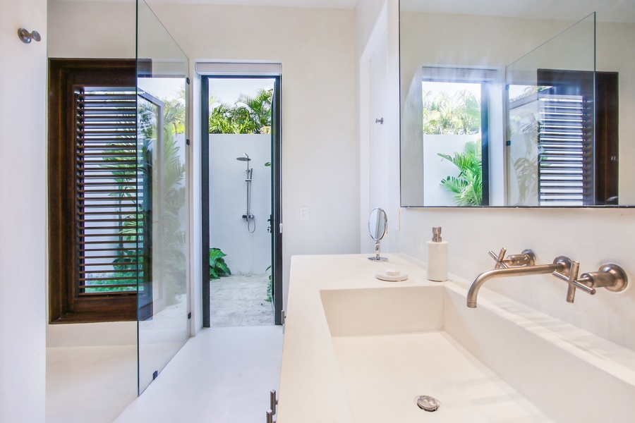 Enjoy the bathroom's indoor-outdoor flow, complete with a private garden shower.
