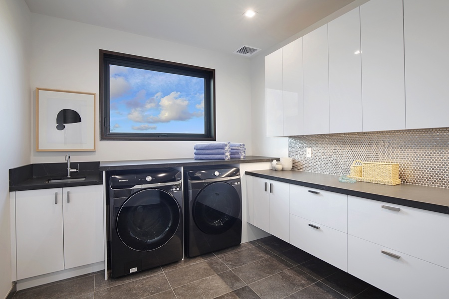 Our luxe home comes with a laundry space with a washer and a dryer to keep you fresh and clean through out your stay!
