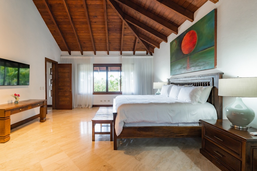 The primary bedroom also feature a king size bed, offering a tranquil and cozy atmosphere.